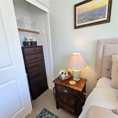 a kitchen with stainless steel appliances granite countertop table chairs refrigerator and microwave