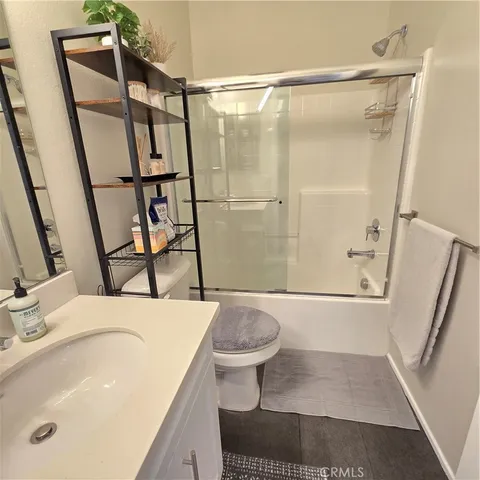 a kitchen with a dining table chairs and microwave
