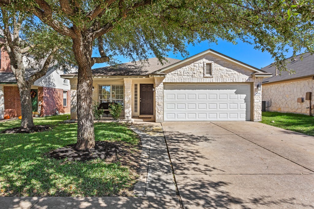 2500 Hutton Lane Leander, TX 78641 - Photo 1 of 1 a front view of a house with a yard and garage