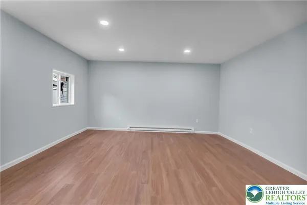 a view of an empty room with a window