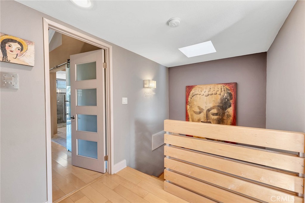 4222 Troost Avenue, Unit 21 Studio City, CA 91604 - Photo 11 of 47 a bedroom with a bed and a mirror