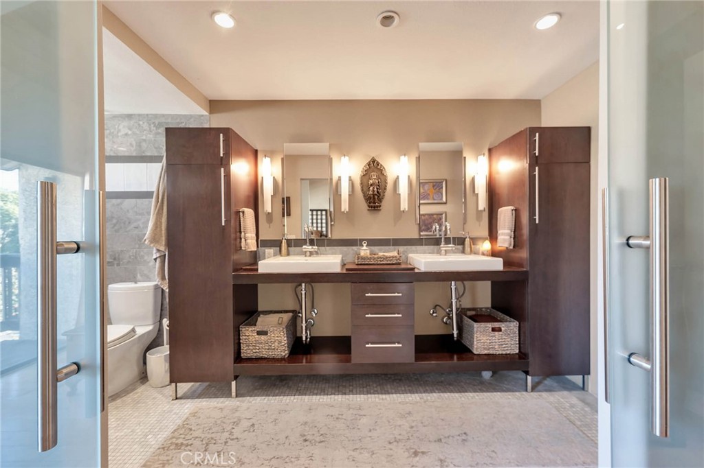 4222 Troost Avenue, Unit 21 Studio City, CA 91604 - Photo 13 of 47 a bathroom with a double vanity sink and a mirror