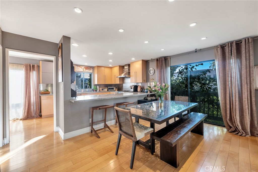 4222 Troost Avenue, Unit 21 Studio City, CA 91604 - Photo 2 of 47 a kitchen with stainless steel appliances granite countertop a refrigerator a sink a stove and a wooden cabinets