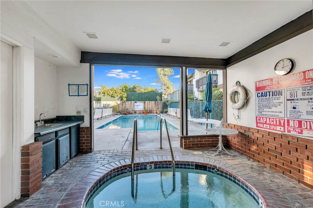 4222 Troost Avenue, Unit 21 Studio City, CA 91604 - Photo 33 of 47 a view of a living room and floor to ceiling window