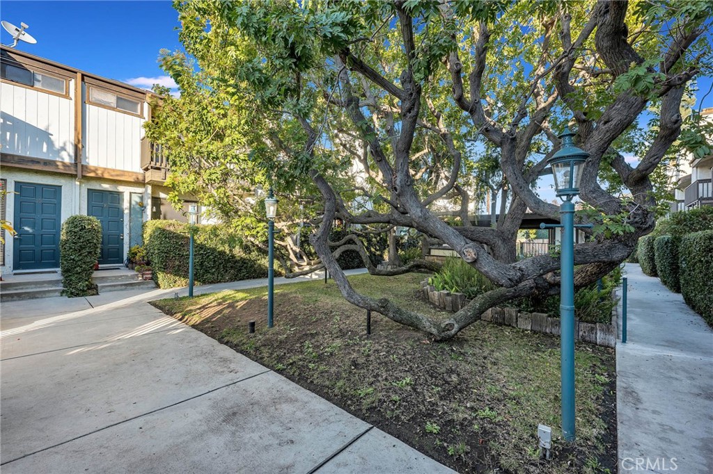 4222 Troost Avenue, Unit 21 Studio City, CA 91604 - Photo 39 of 47 a backyard of a house with lots of green space