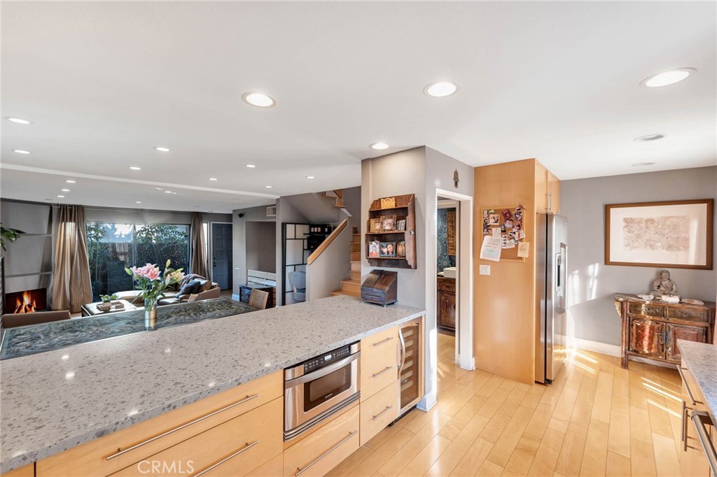 4222 Troost Avenue, Unit 21 Studio City, CA 91604 - Photo 7 of 47 a view of a kitchen with furniture and wooden floor