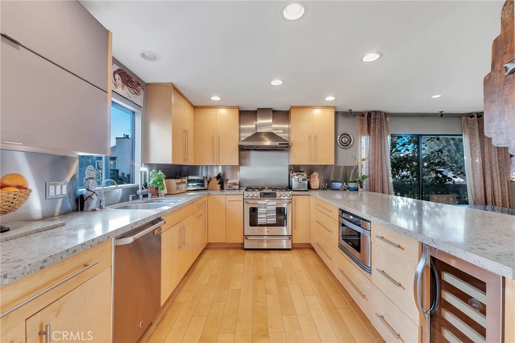 4222 Troost Avenue, Unit 21 Studio City, CA 91604 - Photo 8 of 47 a large kitchen with stainless steel appliances lots of counter space sink and a large window