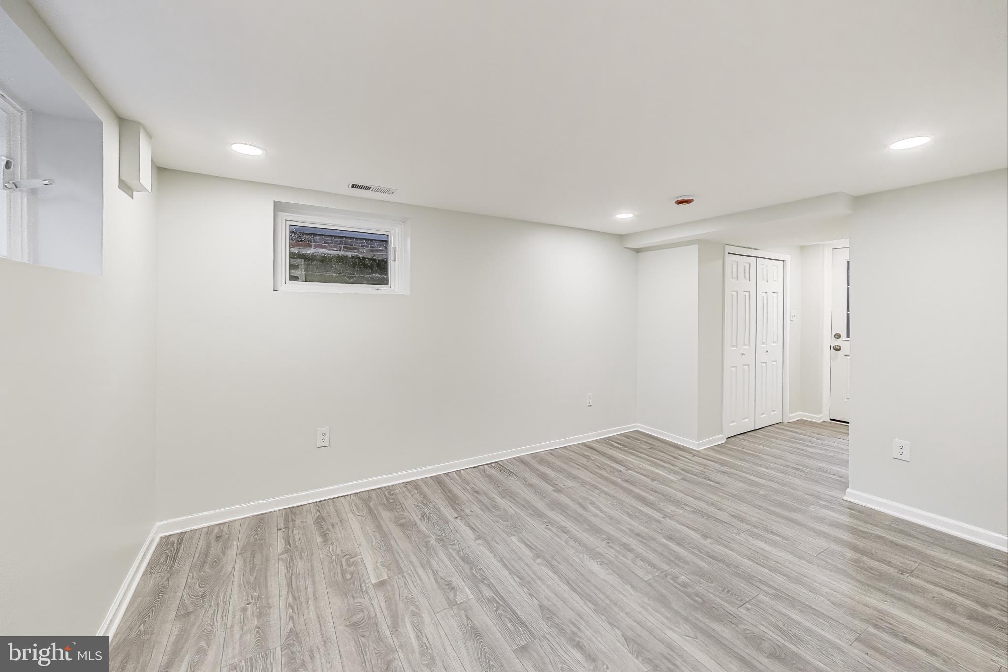 9312 Walden Road Silver Spring, MD 20901 - Photo 26 of 41 a view of an empty room with wooden floor