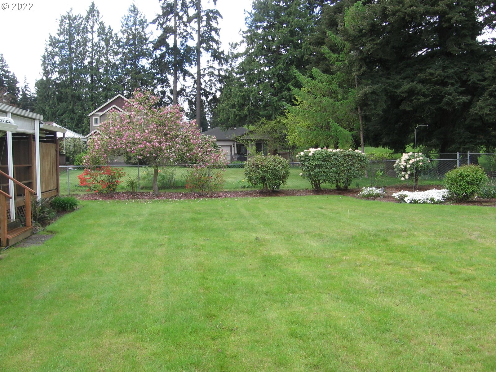 1023 Northeast 172nd Avenue Portland, OR 97230 - Photo 20 of 23 a view of a backyard with large trees