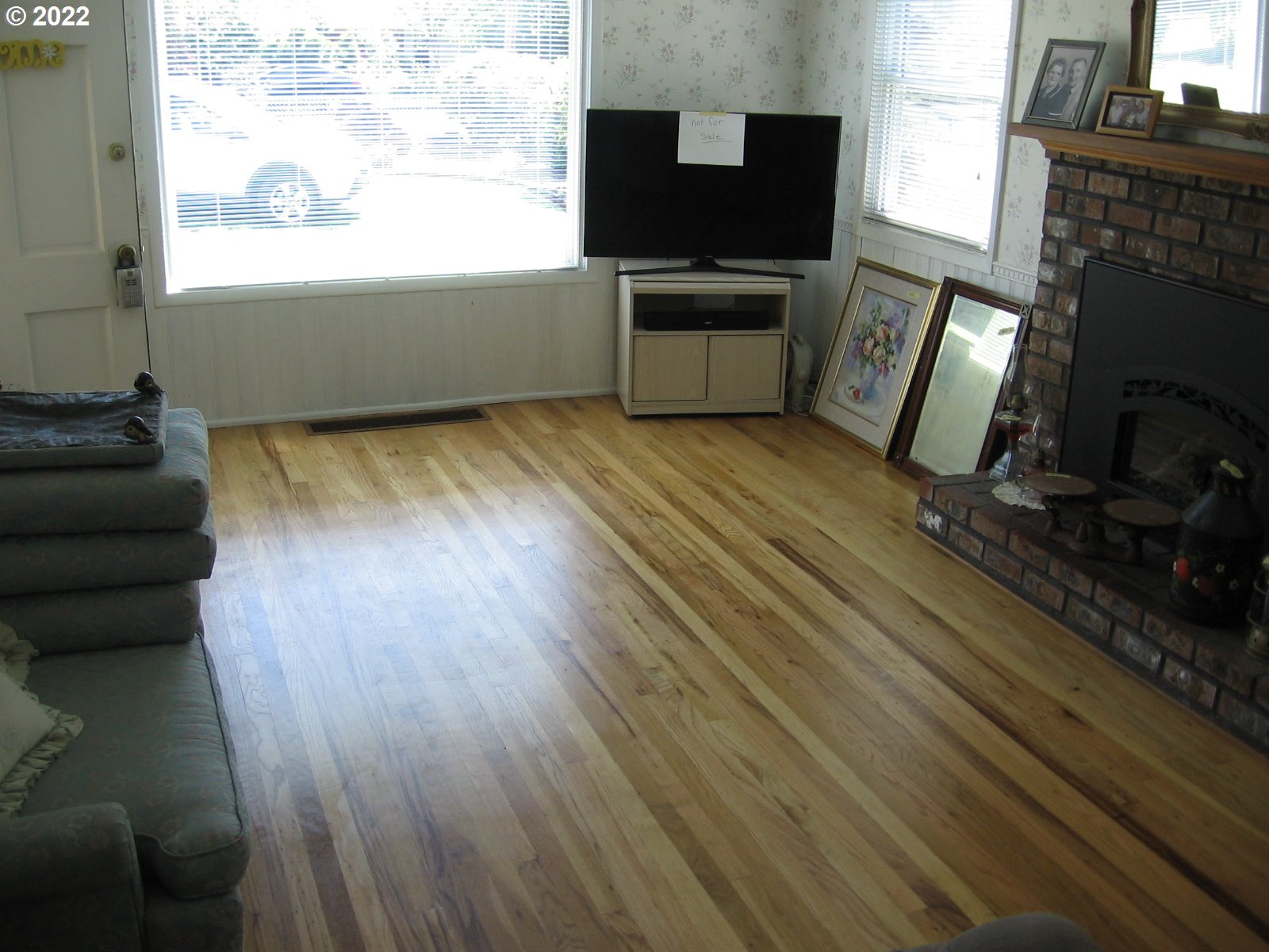 1023 Northeast 172nd Avenue Portland, OR 97230 - Photo 4 of 23 a living room with furniture and a flat screen tv