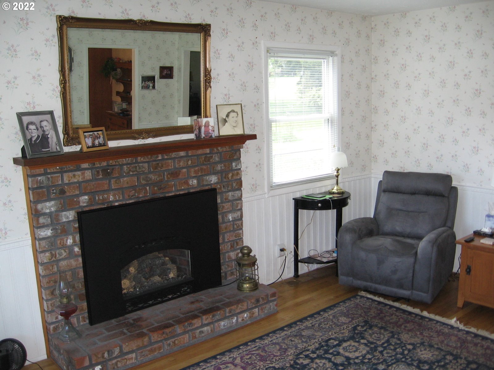 1023 Northeast 172nd Avenue Portland, OR 97230 - Photo 5 of 23 a living room with furniture and a fireplace