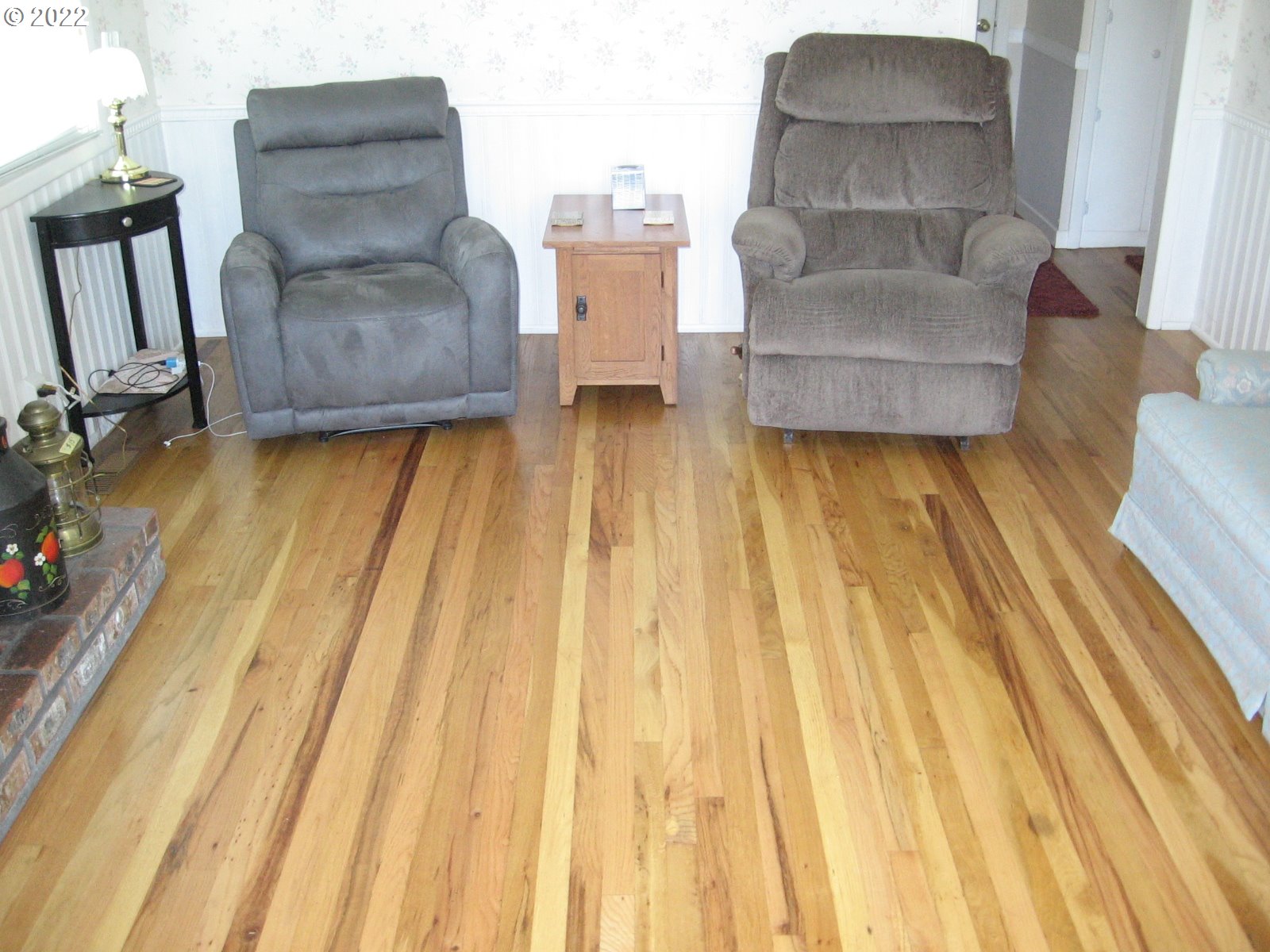 1023 Northeast 172nd Avenue Portland, OR 97230 - Photo 6 of 23 a living room with furniture and a floor to ceiling window