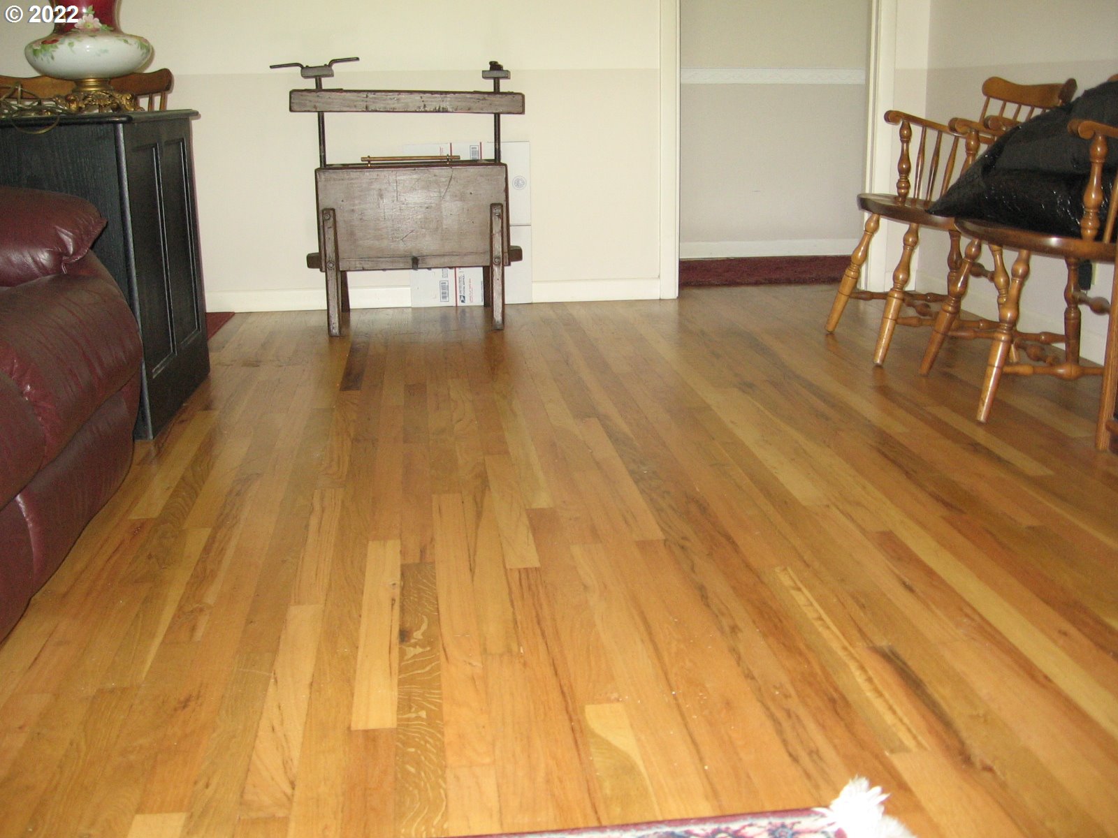 1023 Northeast 172nd Avenue Portland, OR 97230 - Photo 7 of 23 a chair and table sitting in a room