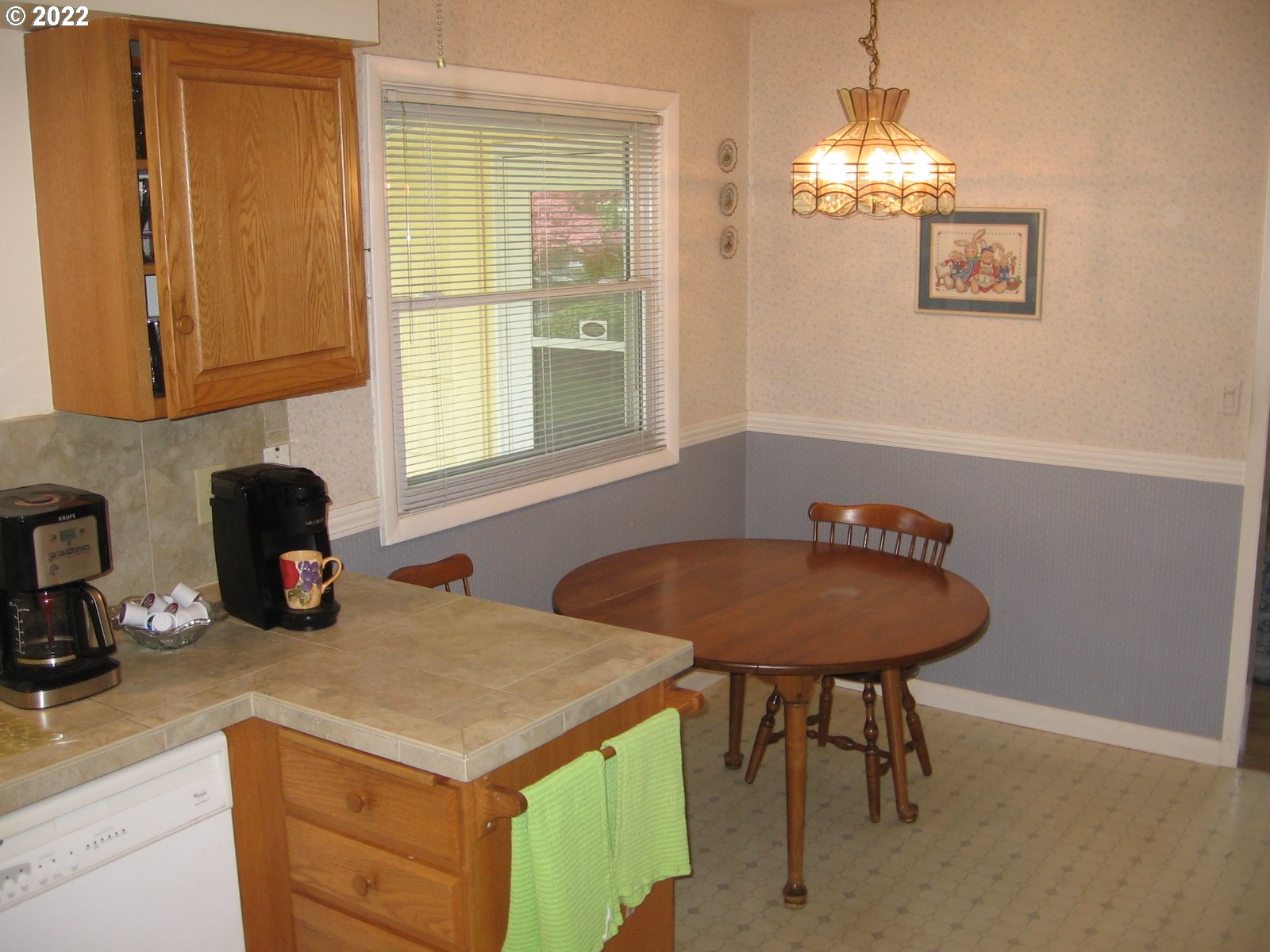 1023 Northeast 172nd Avenue Portland, OR 97230 - Photo 10 of 23 a kitchen with a sink cabinets and window