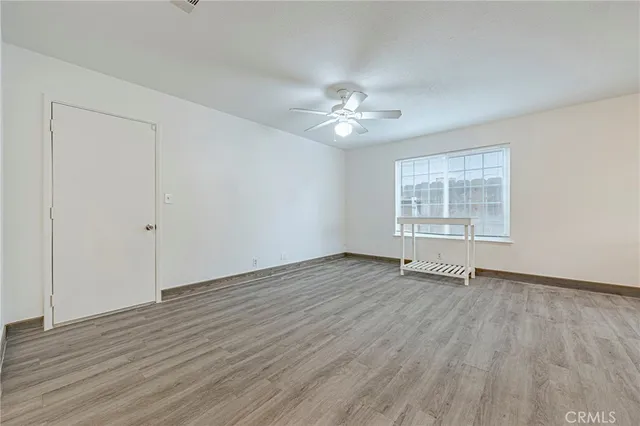 an empty room with a empty space and windows