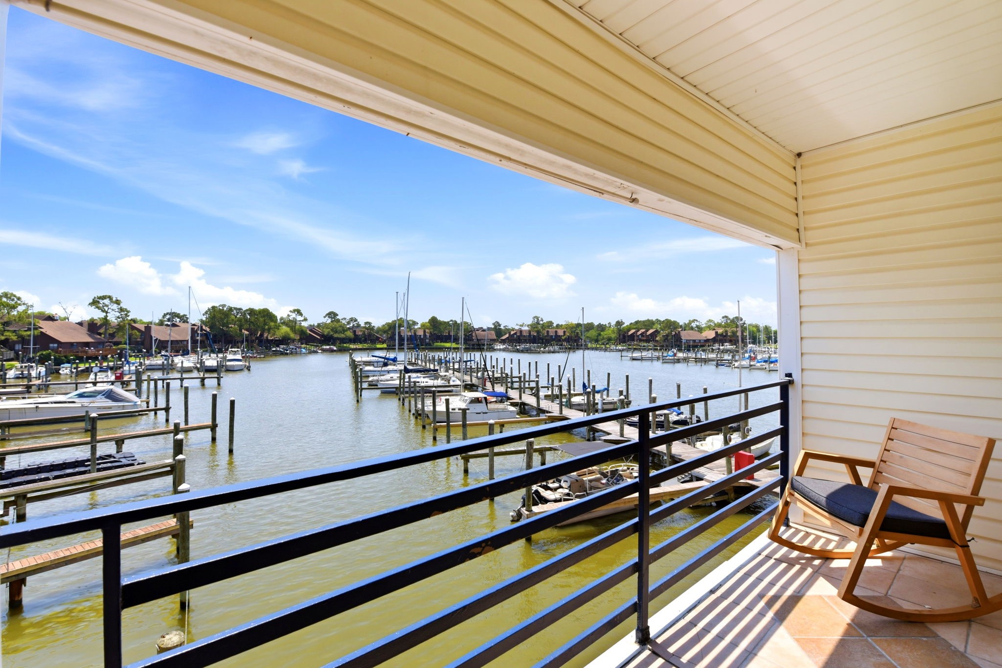 793 Davis Road, Unit 113 League City, TX 77573 - Photo 1 of 39 a view of a balcony with wooden benches