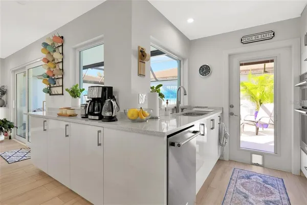 a kitchen with sink and window