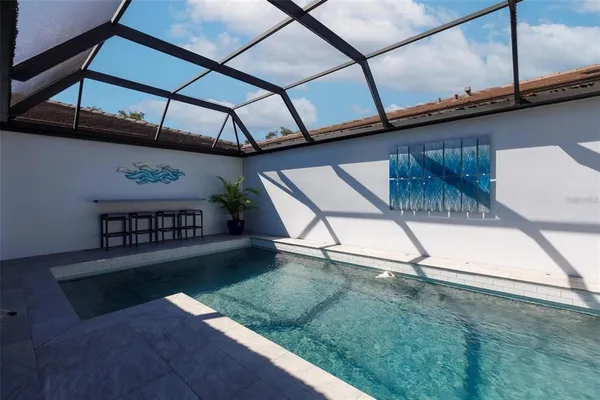 a view of swimming pool with a yard