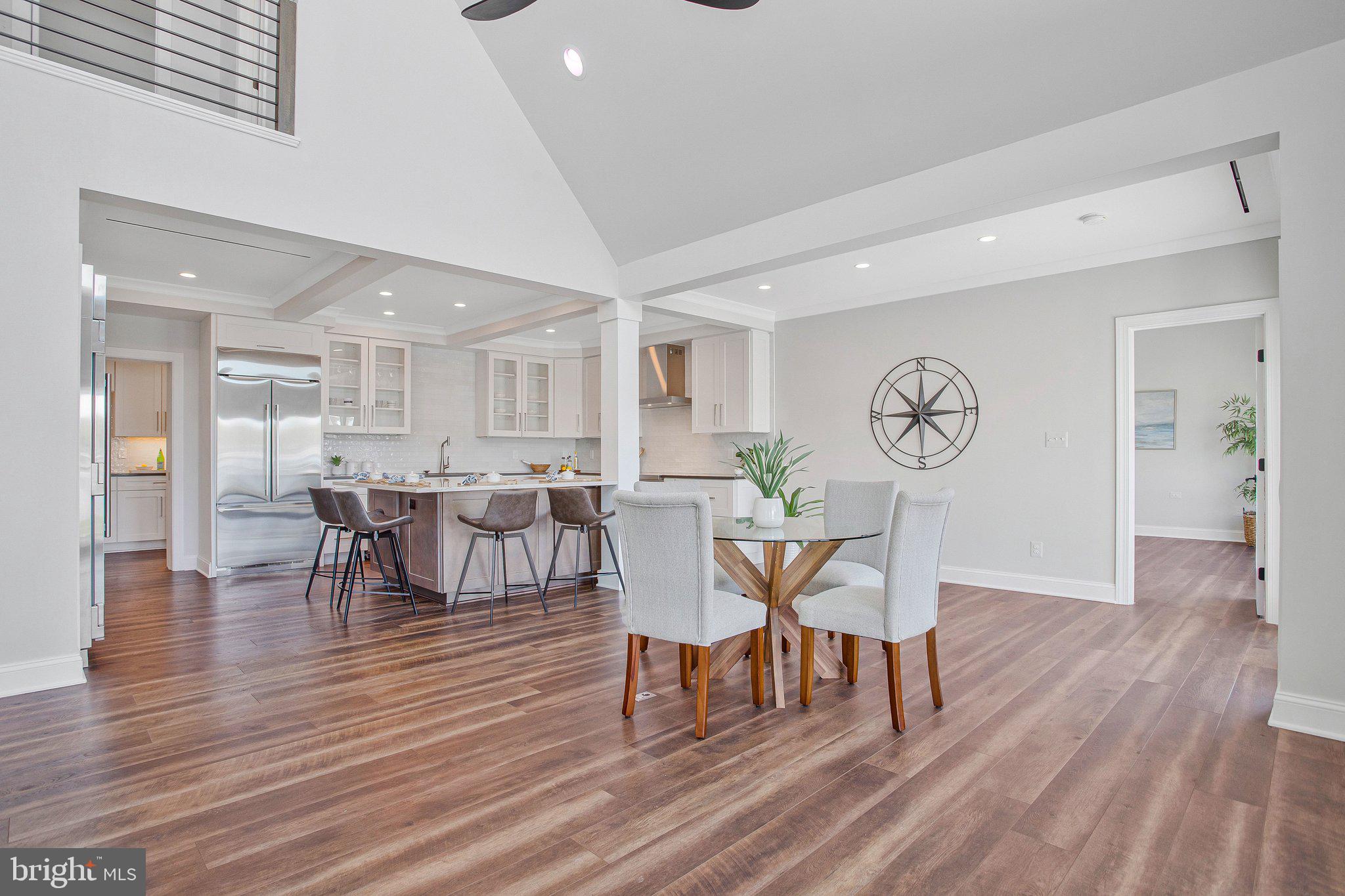 6146 Drum Point Road Deale, MD 20751 - Photo 9 of 75 a view of a dining room with furniture and wooden floor