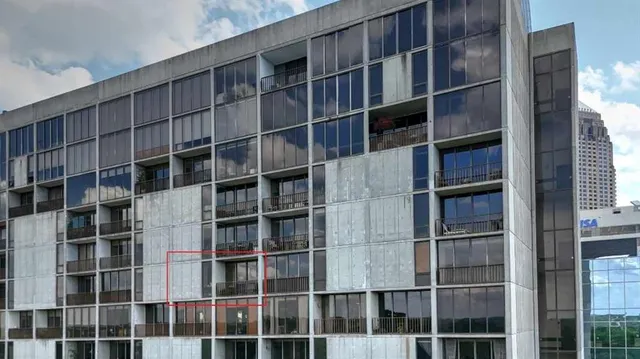 a view of a room with wooden shelves