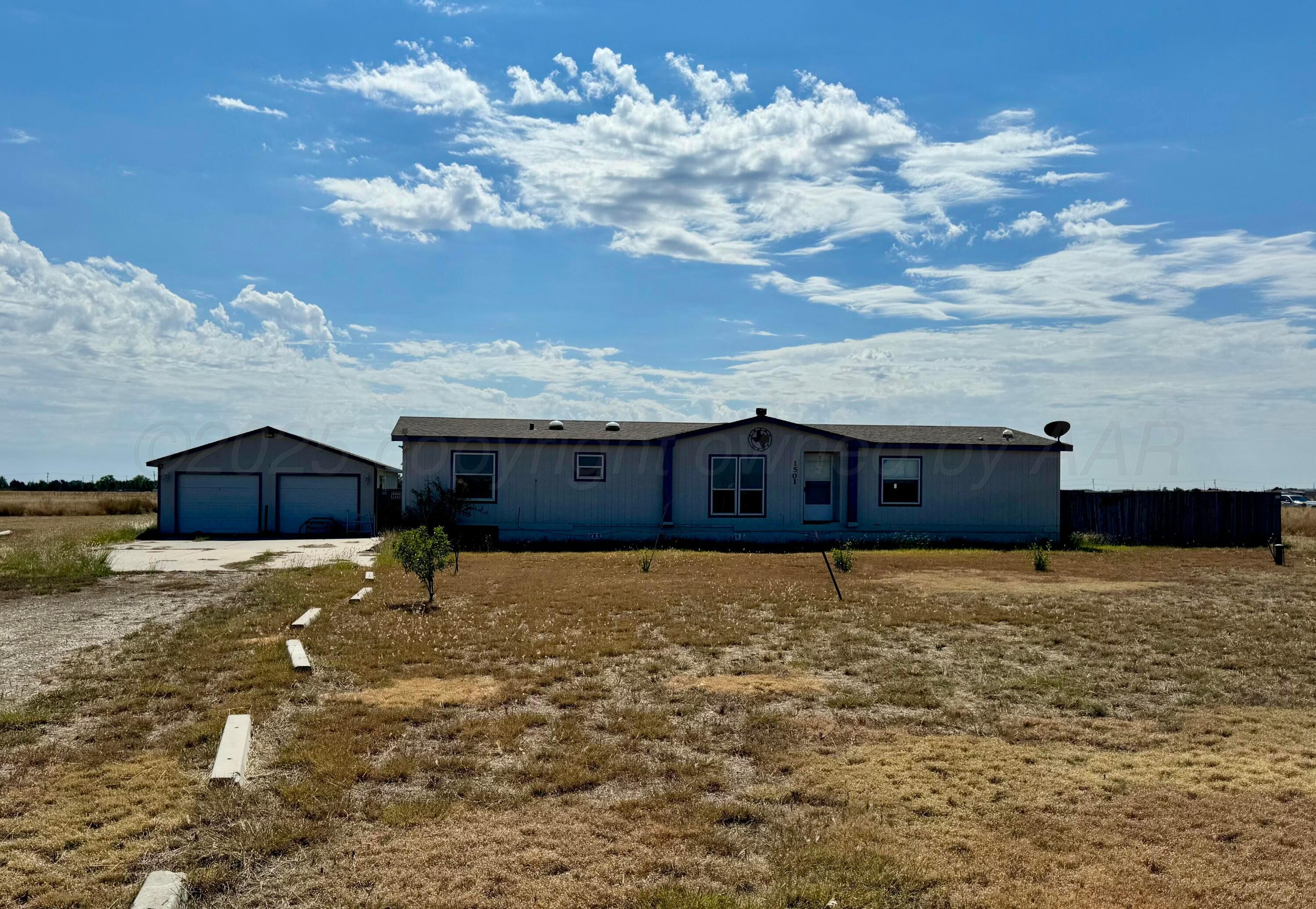 a big yard with table and chairs