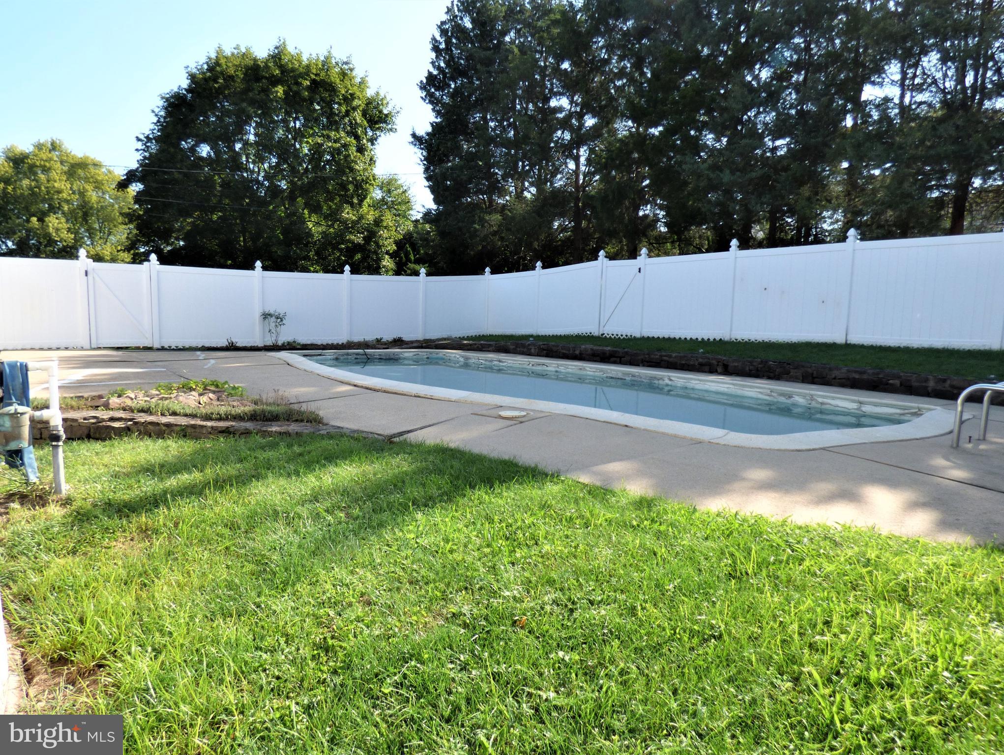 251 Parry Road Warminster, PA 18974 - Photo 31 of 34 Pool Surrounded by Vinyl Fencing & Mature Trees
