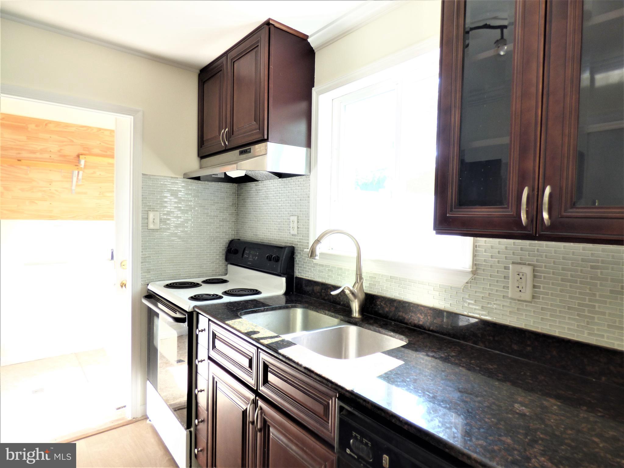 251 Parry Road Warminster, PA 18974 - Photo 9 of 34 Kitchen Cabinetry, Doorway to Laundry Room