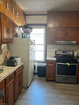 a kitchen with a stove and a sink