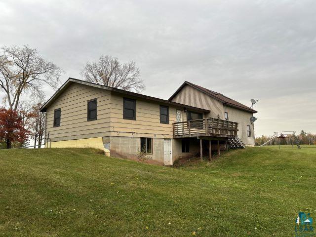 8353 Mannik Road Iron River, WI 54847 - Photo 10 of 48 Back of house with a yard and a deck