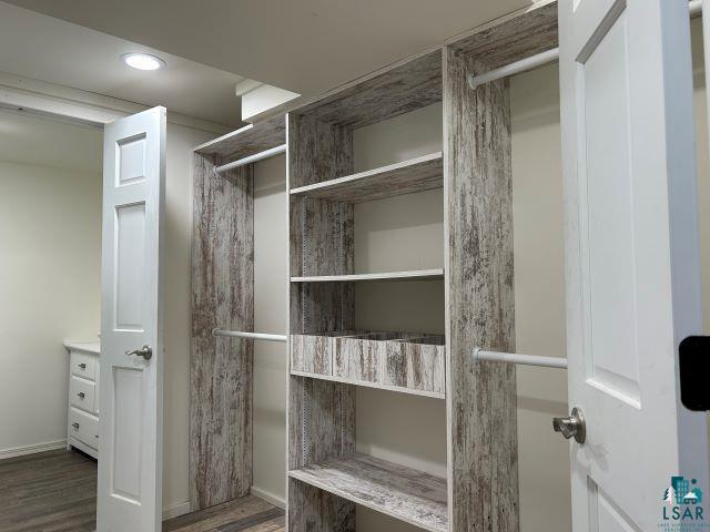 8353 Mannik Road Iron River, WI 54847 - Photo 15 of 48 Spacious closet with wood finished floors