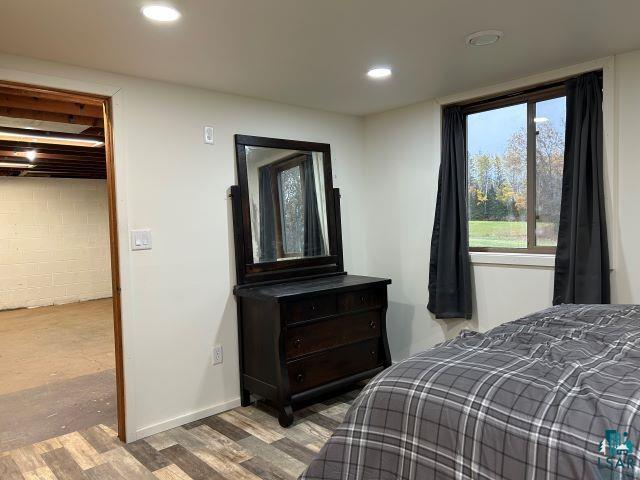 8353 Mannik Road Iron River, WI 54847 - Photo 18 of 48 Bedroom featuring wood finished floors and recessed lighting