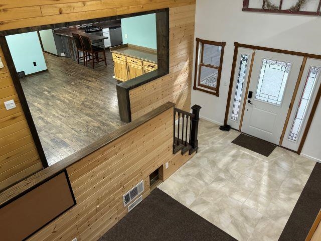 8353 Mannik Road Iron River, WI 54847 - Photo 33 of 48 Entrance foyer with wooden walls