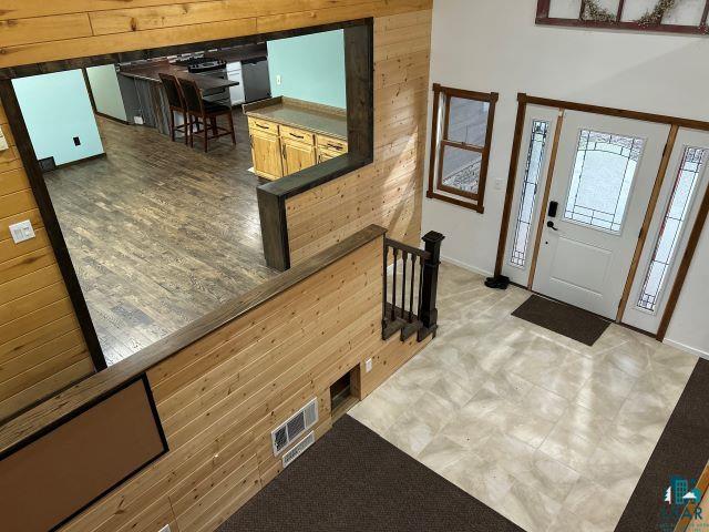 8353 Mannik Road Iron River, WI 54847 - Photo 33 of 48 Entrance foyer with wooden walls