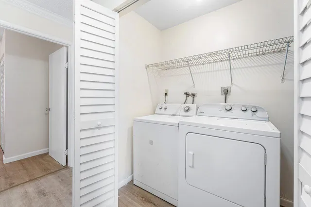 a utility room with dryer and washer