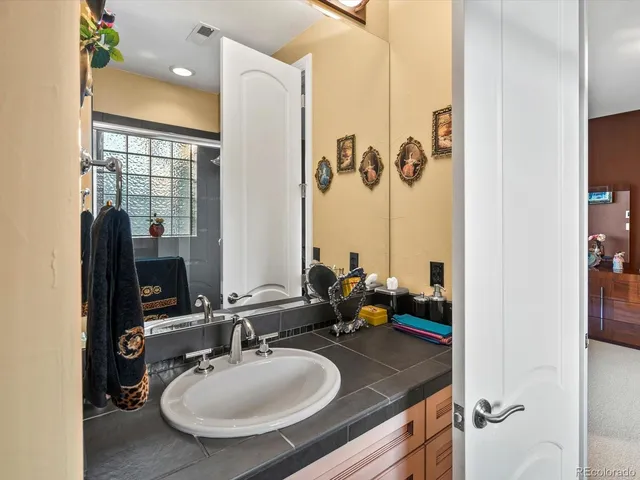 a bathroom with a sink double vanity and a mirror