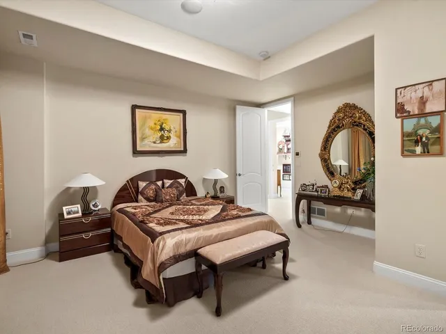 a bedroom with bed and a furniture