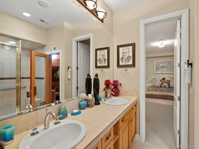 a bathroom with a sink vanity and a mirror