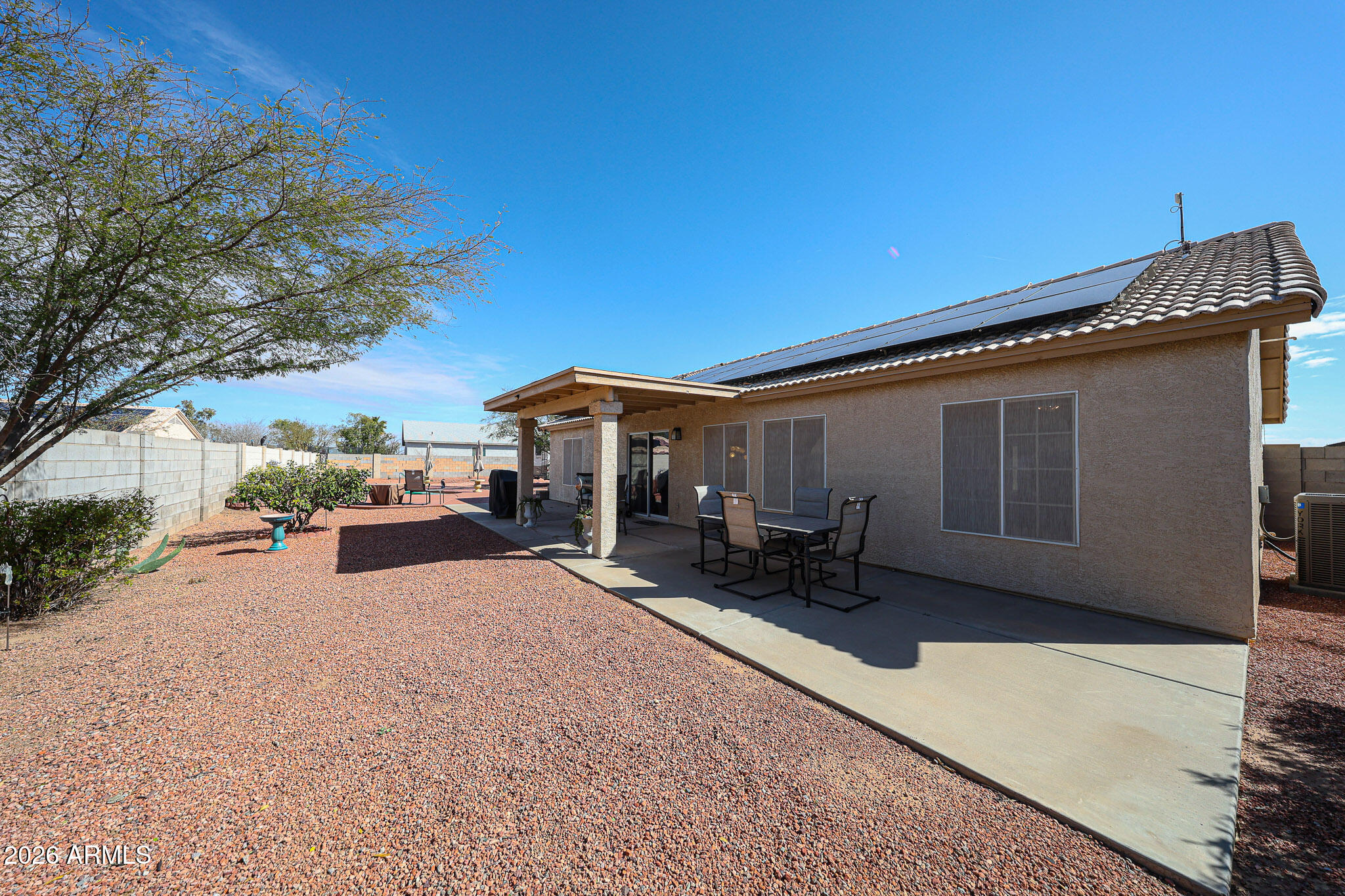 14980 South Capistrano Road Arizona City, AZ 85123 - Photo 33 of 39 a patio with table and chairs and potted plants