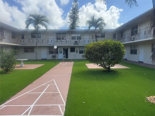 a view of a house with a garden