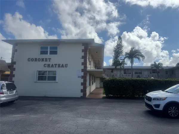 a front view of a house with parking