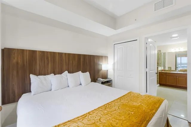 a bedroom with a bed and a couch