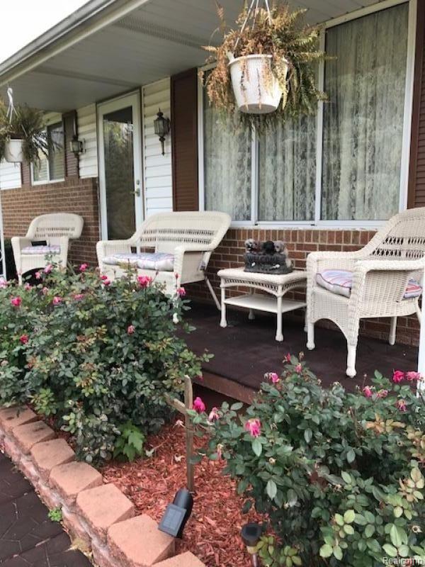 3961 Washburn Road Vassar, MI 48768 - Photo 22 of 25 The beautiful roses accent this covered front porch.
