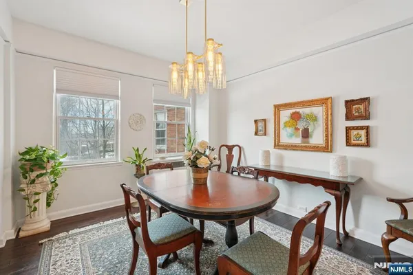 a view of a dining room with furniture and window