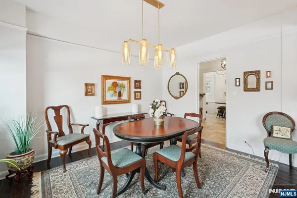 a dining room with furniture and a clock