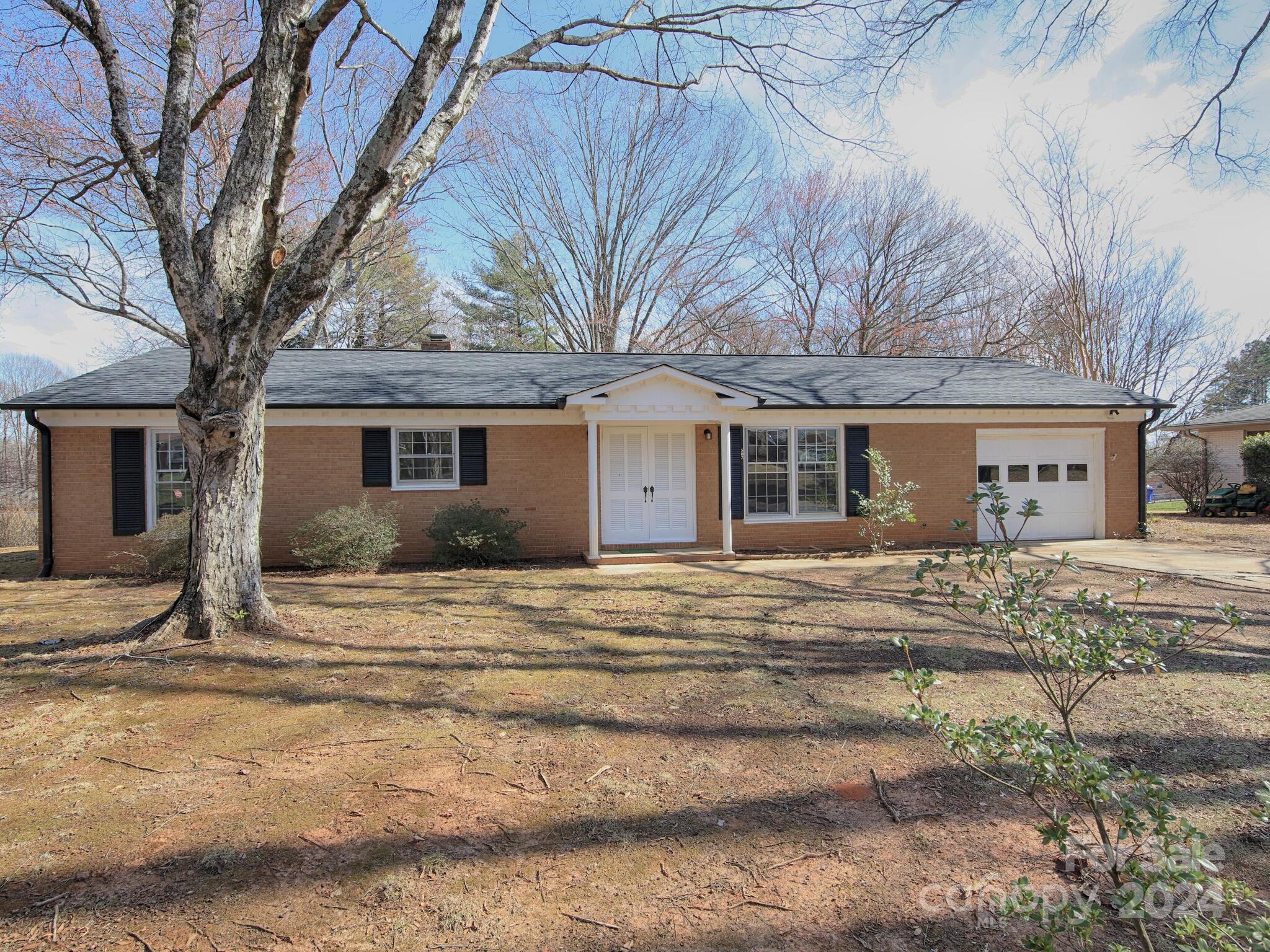 502 Fieldstone Road Mooresville, NC 28115 - Photo 3 of 40 a view of a house with a yard covered in snow