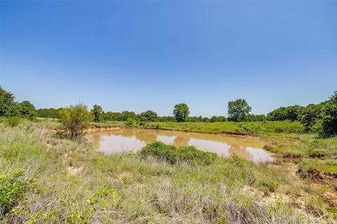 a view of lake with green space