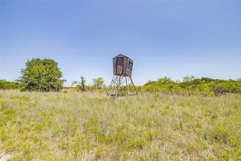 a view of a playground with basketball court