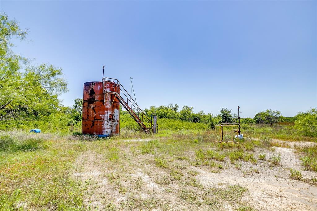 613 County Road 3848 Poolville, TX 76487 - Photo 20 of 40 a view of a playground with basketball court