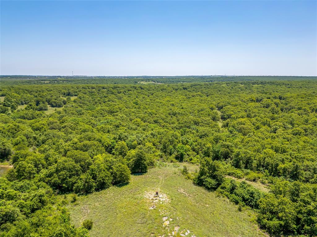 613 County Road 3848 Poolville, TX 76487 - Photo 24 of 40 a view of a field with an ocean