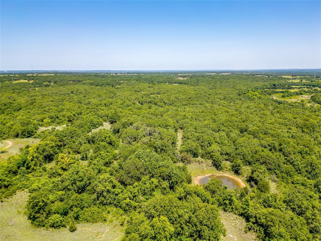 613 County Road 3848 Poolville, TX 76487 - Photo 25 of 40 a view of an ocean and beach